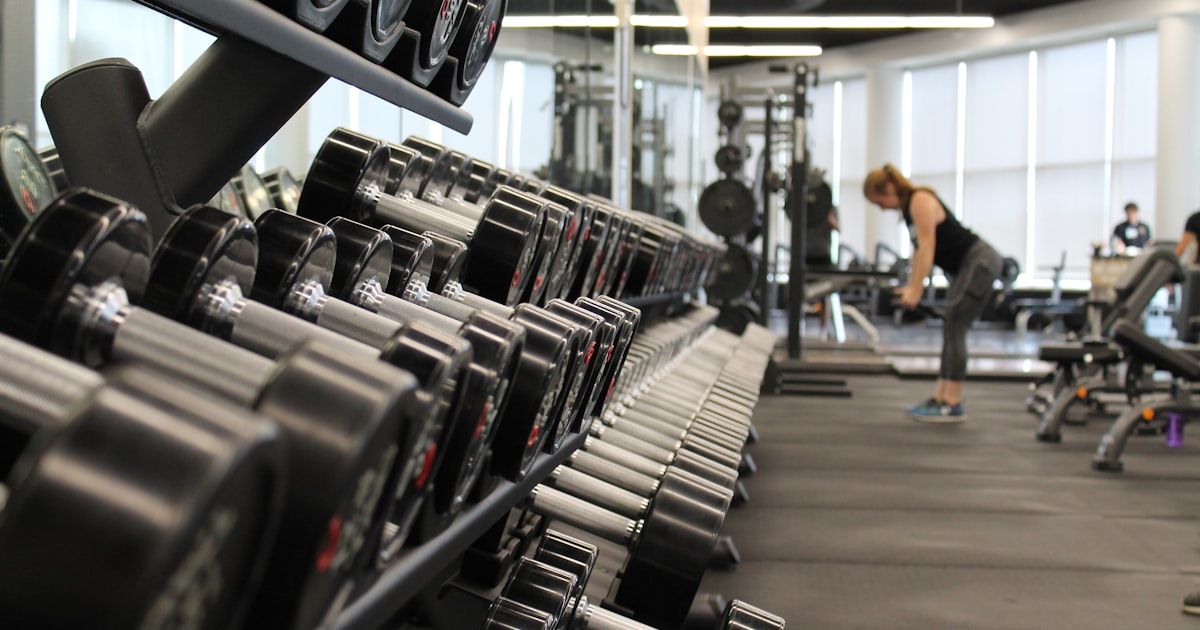 Modern fitness facility with training equipment and open floor space