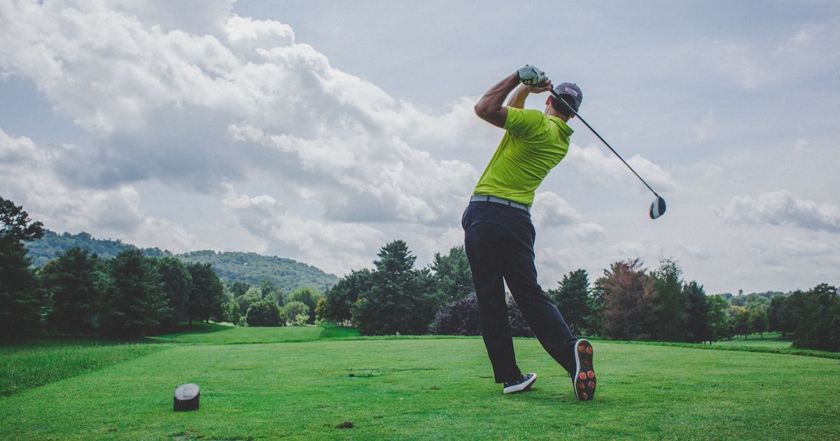 Golfer demonstrating correct golf posture and spine angle at address
