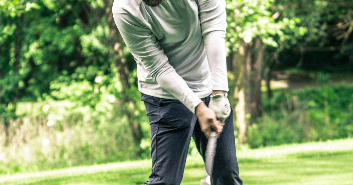 Golfer driving the ball off the tee for maximum distance