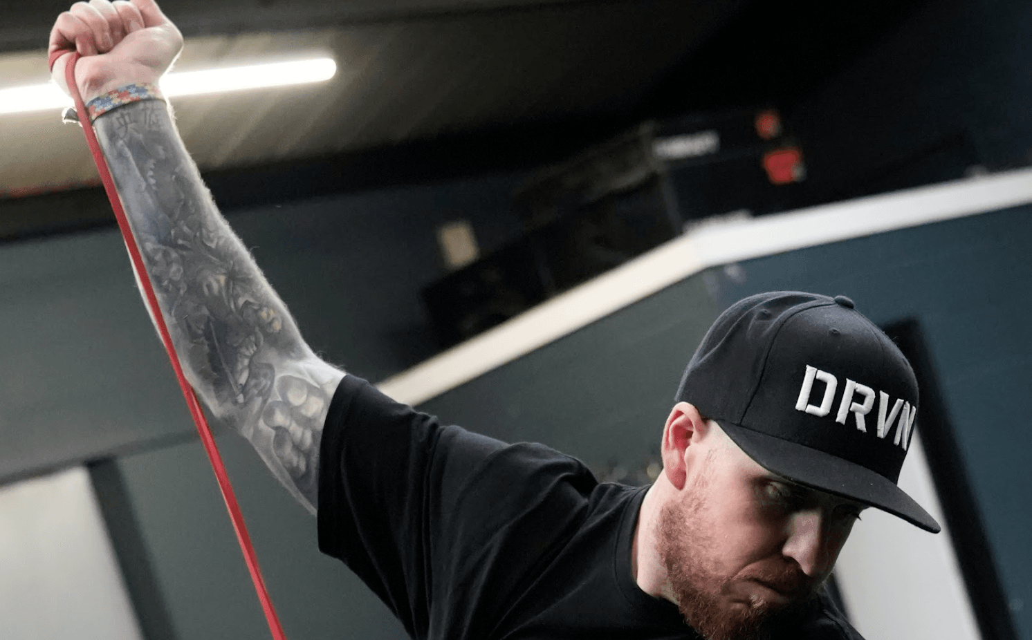DRVN Certified Pro training with resistance band